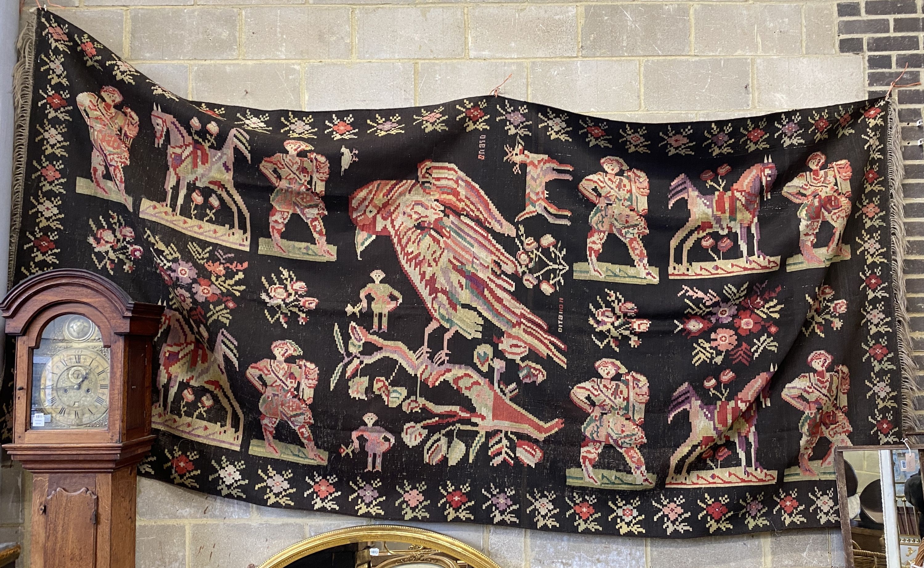 An antique Ukranian flatweave carpet woven with figures and birds, approx. 350 x 170cm